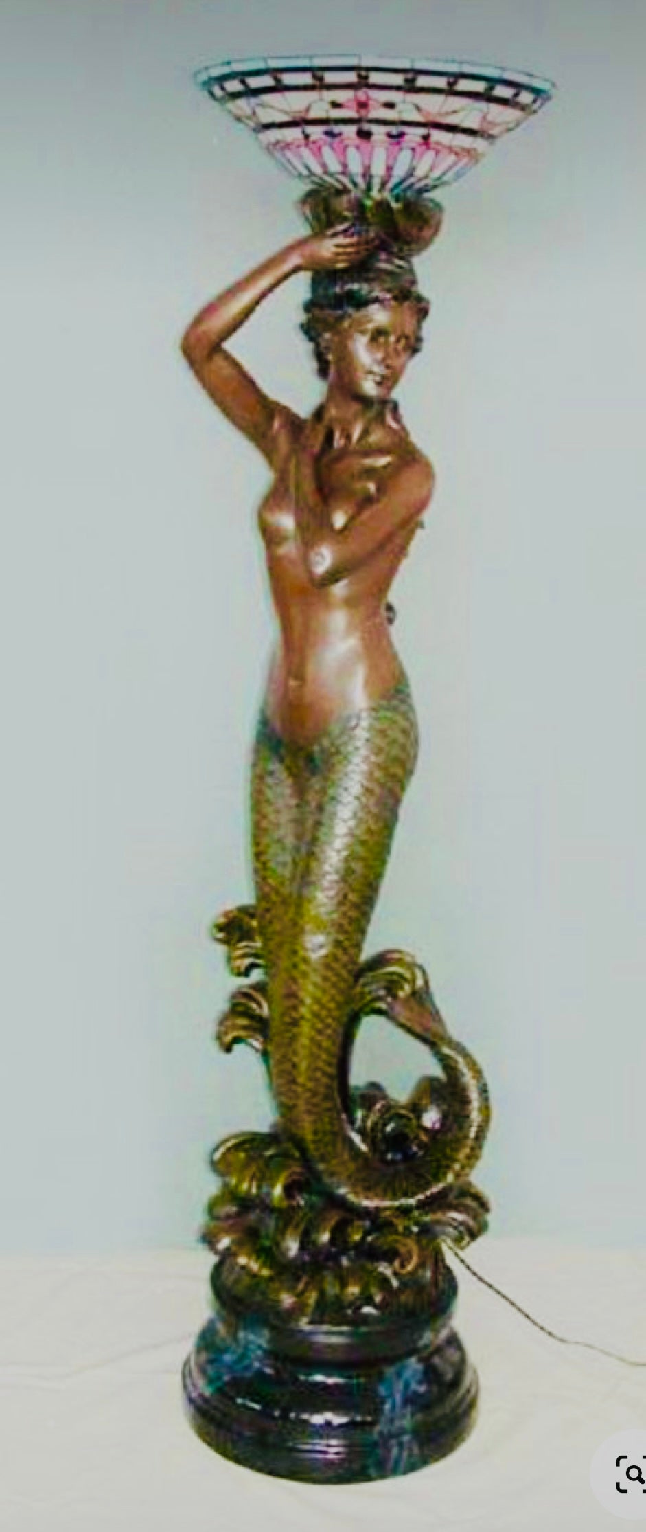 Mermaid floor lamp holding Tiffany glass lamp
